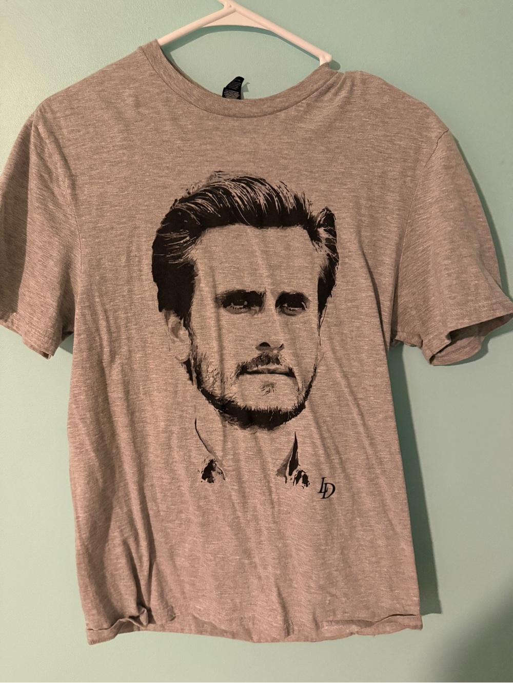 District Men's Heather Gray Short Sleeve Tee with Black Face Graphic